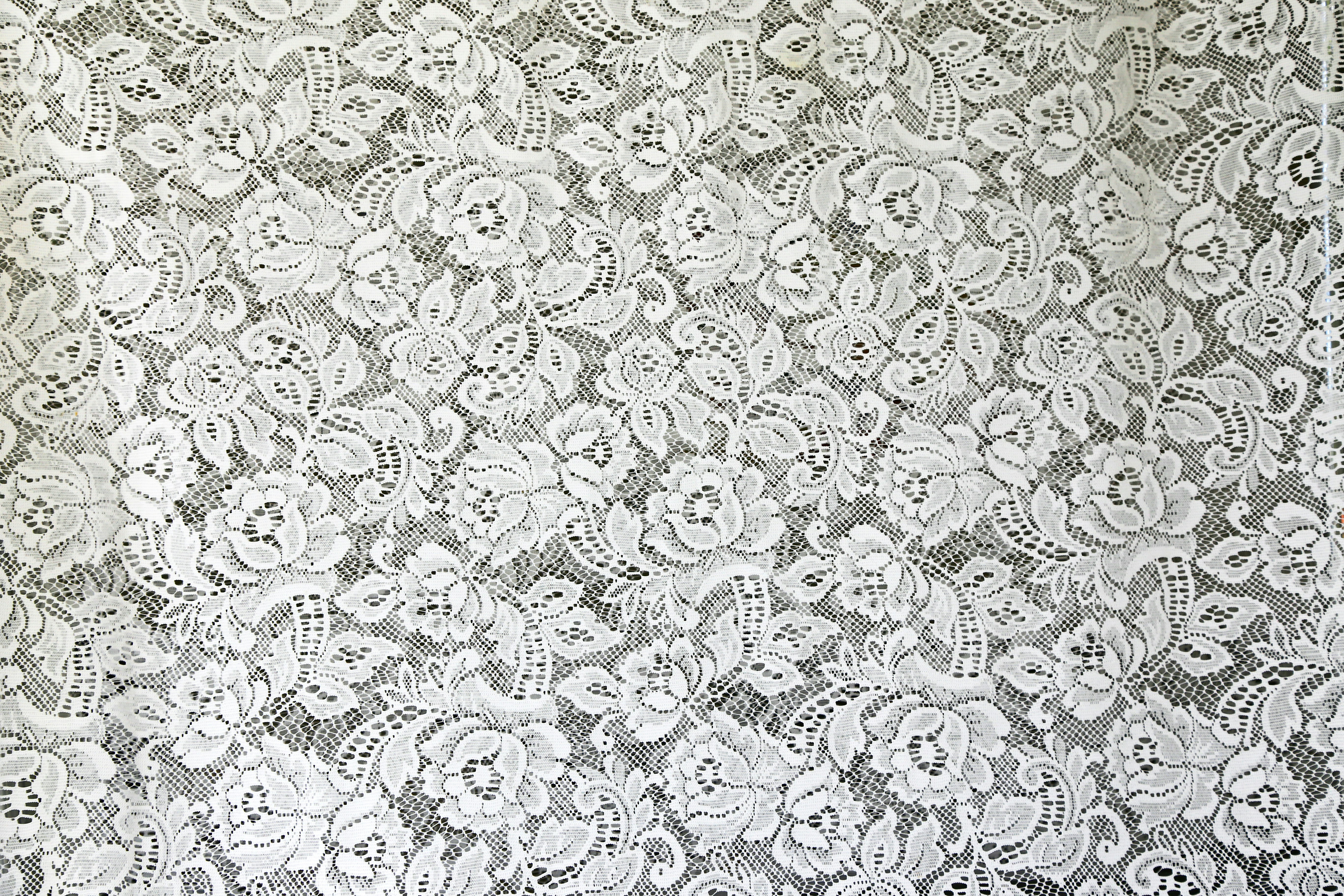 white and black floral textile